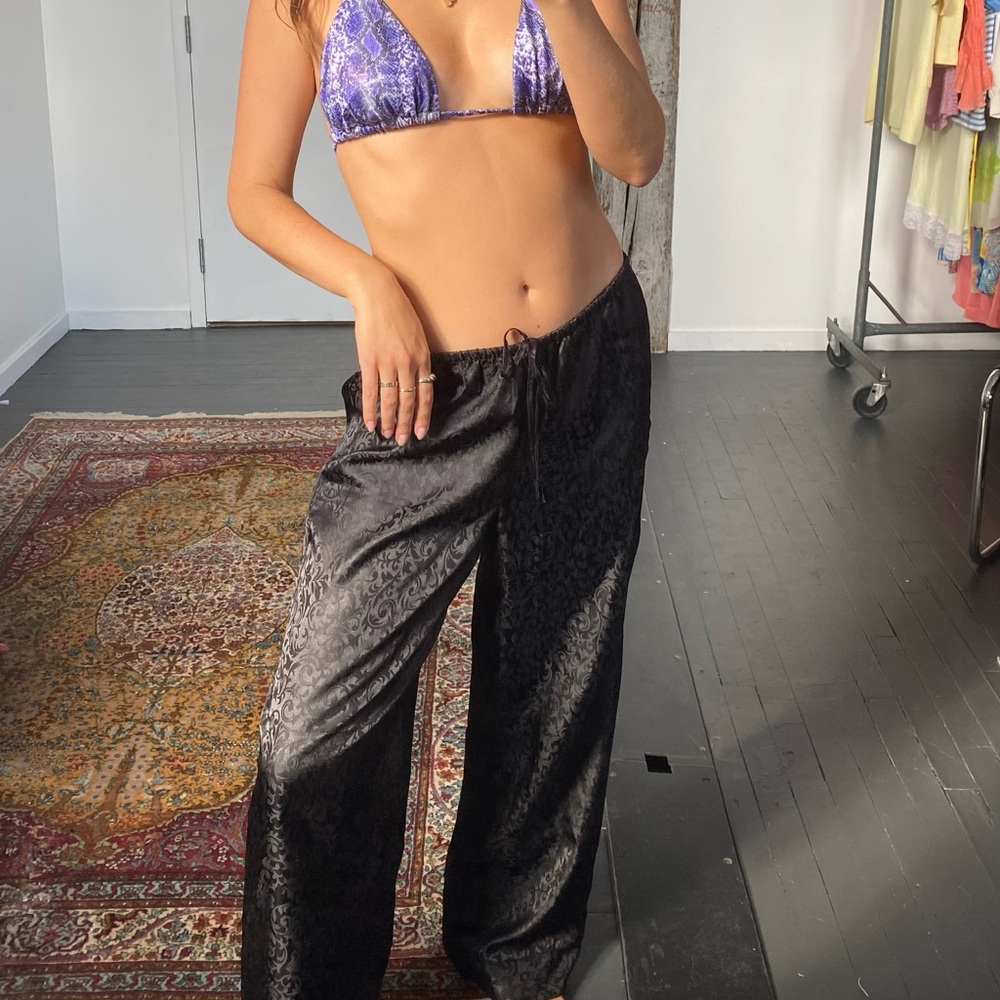 Size medium silky black pants with a drawstring and elastic waist.